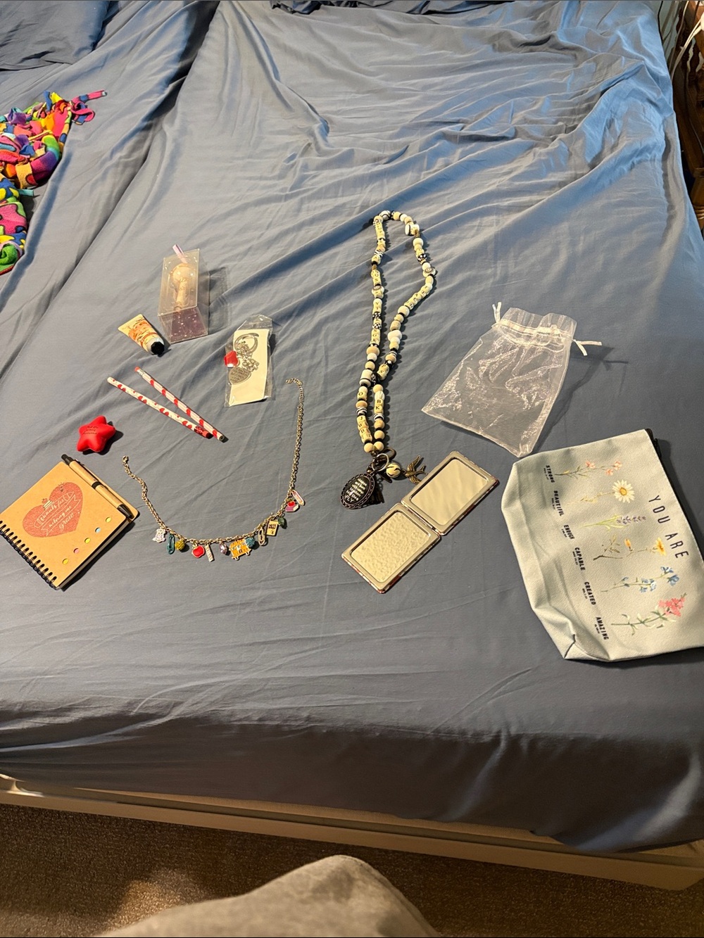 bundle of  necklaces , notebook. Keychain, lotion, lip balm, mirror for teacher